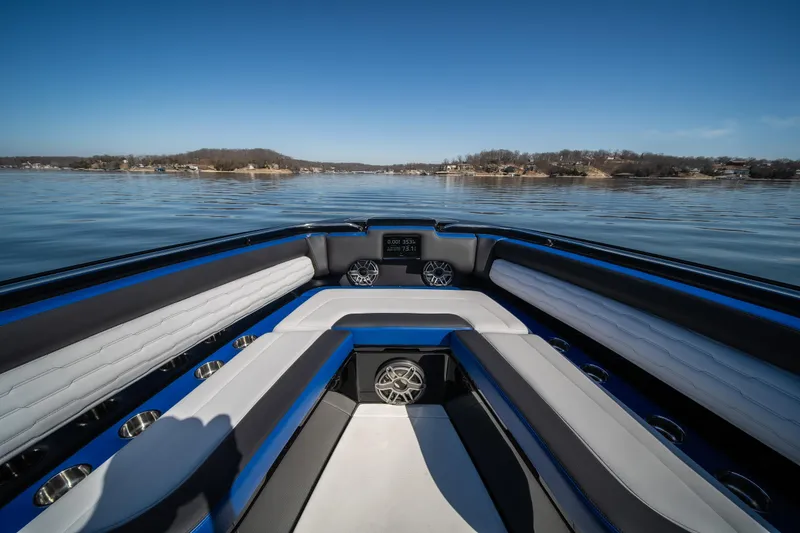 Slide: The Image of 2025 Cigarette 42 Auroris boat interior with sleek seating on a calm lake. - 28