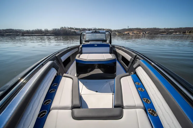 Slide: The Image of 2025 Cigarette 42 Auroris boat interior with blue and white seating on calm water. - 31
