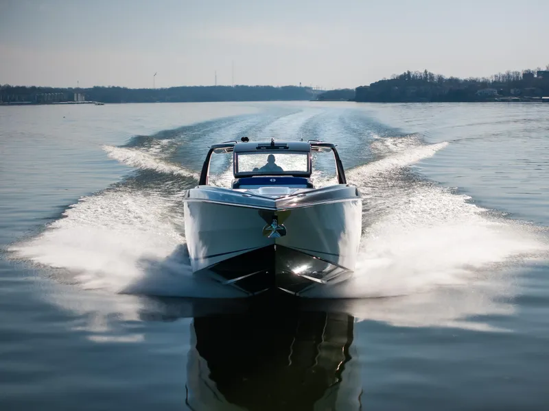 Slide: The Image of 2025 Cigarette 42 Auroris speedboat cruising on a calm lake. - 36