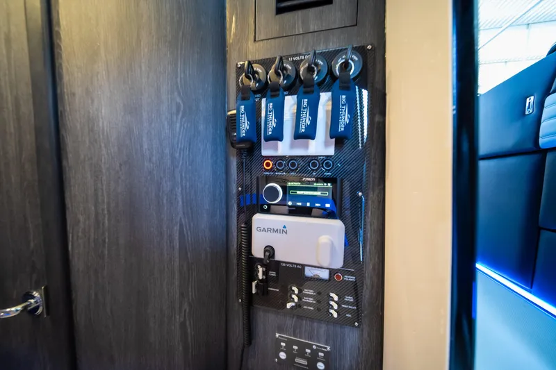 Slide: The Image of Control panel inside 2025 Cigarette 42 Auroris boat, featuring advanced Garmin navigation system. - 38