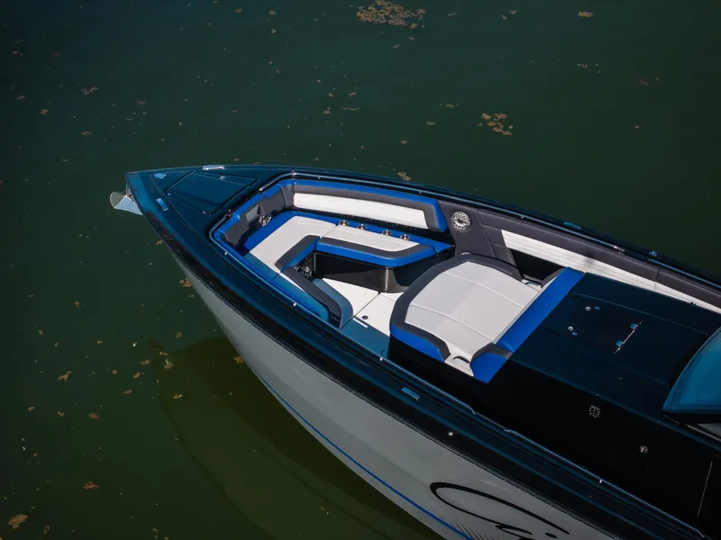 Slide: The Image of 2025 Cigarette 42 Auroris boat with sleek design and blue-accented seating. - 4