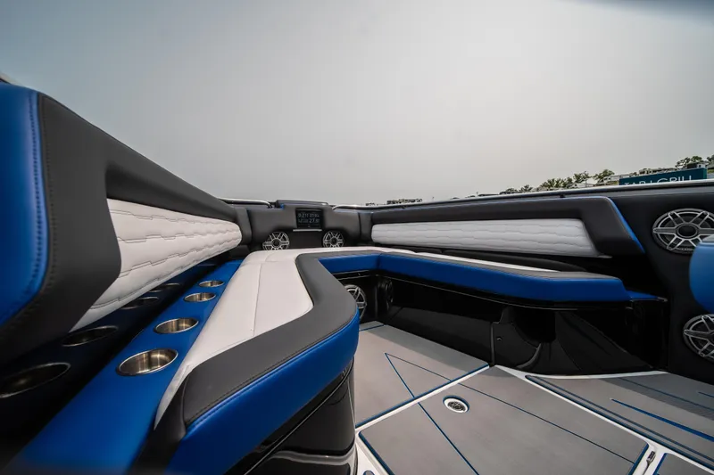 Slide: The Image of 2025 Cigarette 42 Auroris boat interior with blue and white seating, modern design. - 46