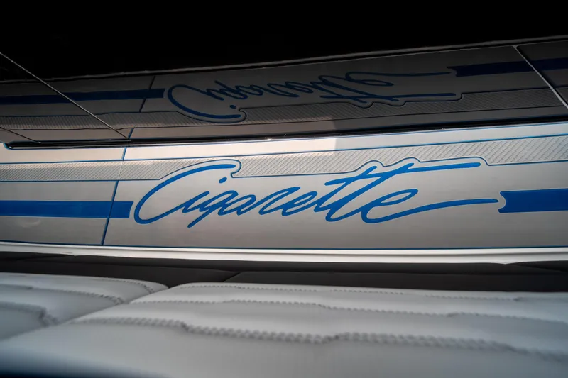 Slide: The Image of 2025 Cigarette 42 Auroris boat with sleek blue and white design. - 49