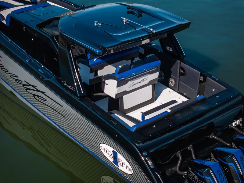 Slide: The Image of 2025 Cigarette 42 Auroris boat with sleek design and powerful engines on calm water. - 5