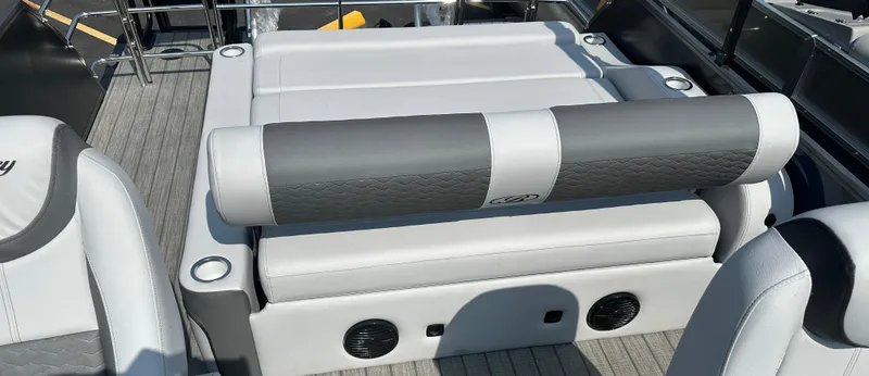 Slide: The Image of 2025 Bentley Pontoons Elite 223 Swingback Dual Capt. interior with gray seating and cup holders. - 10