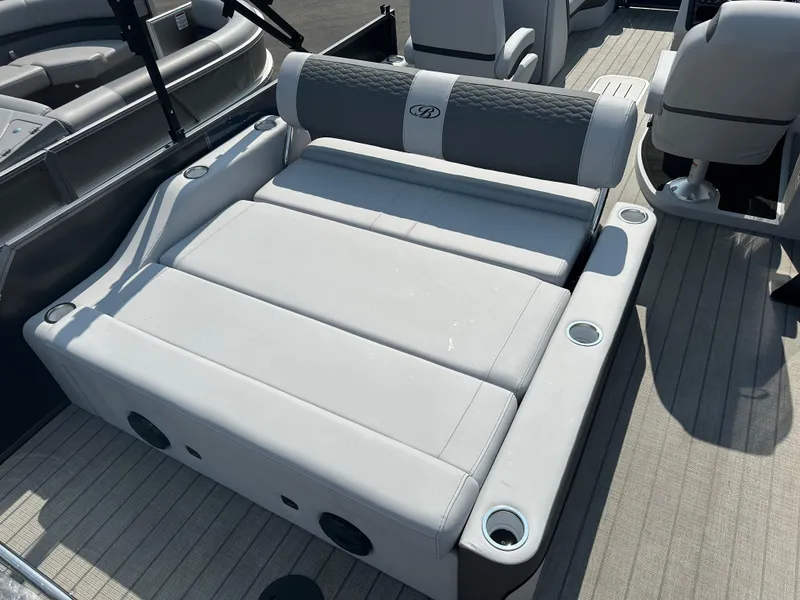 Slide: The Image of 2025 Bentley Pontoons Elite 223 Swingback Dual Capt. seating area with cup holders. - 11