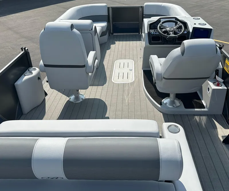 Slide: The Image of 2025 Bentley Pontoons Elite 223 Swingback Dual Capt. interior with modern seating and steering console. - 4