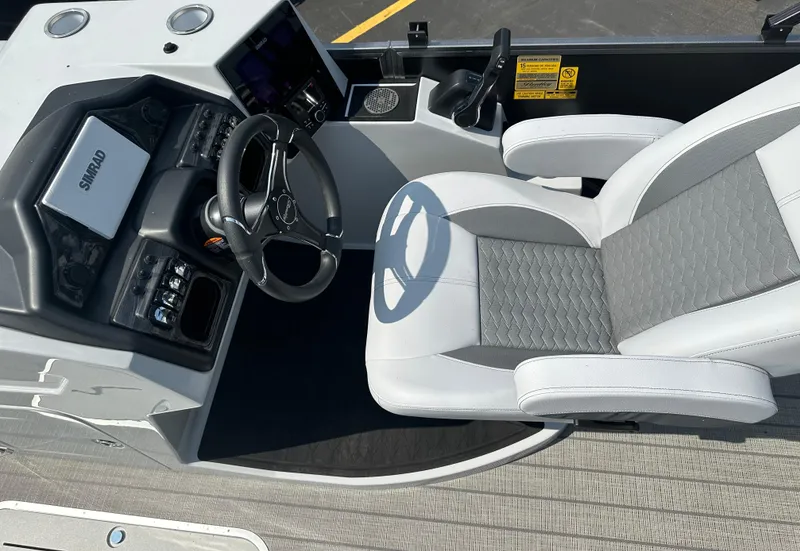 Slide: The Image of 2025 Bentley Pontoons Elite 223 Swingback Dual Capt. helm with modern controls and comfortable seating. - 5