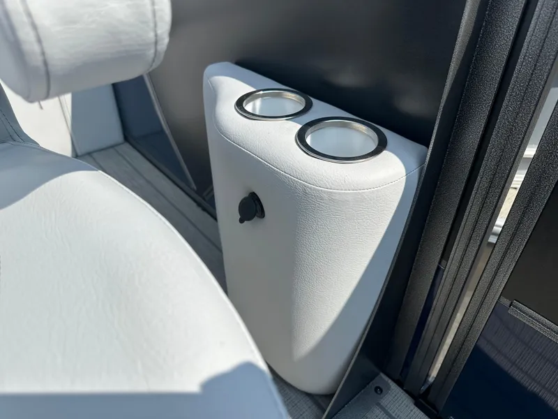 Slide: The Image of 2025 Bentley Pontoons Elite 223 interior cup holders and seating detail. - 8