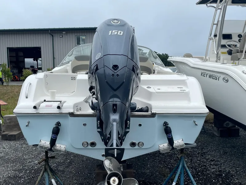 Slide: The Image of 2025 Key West 203 DFS boat with 150 HP outboard motor on display. - 2