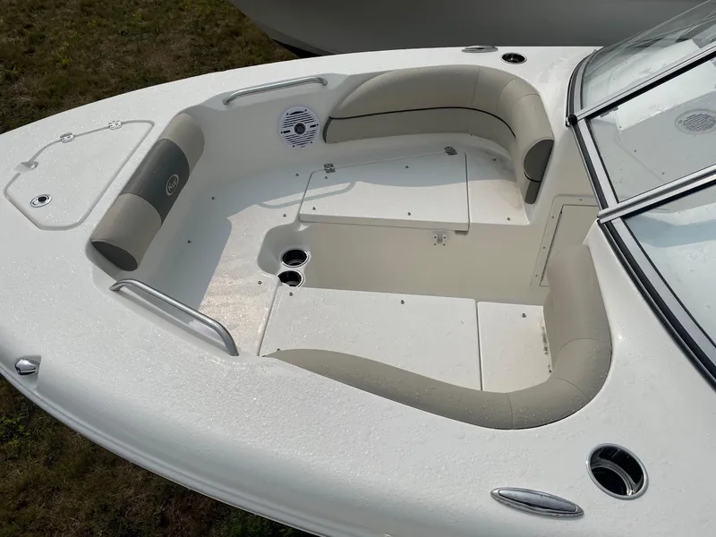 Slide: The Image of 2025 Key West 203 DFS boat interior with cushioned seating and cup holders. - 3