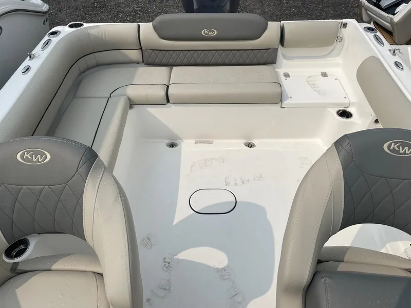 Slide: The Image of Interior of 2025 Key West 203 DFS boat with cushioned seating and cup holders. - 6
