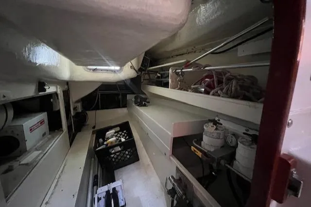 Slide: The Image of Interior of a 1994 J Boats J 44 sailboat, showcasing storage and equipment. - 11