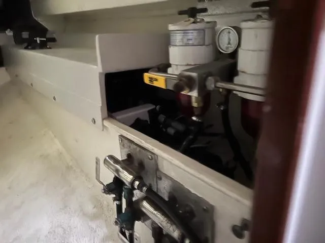 Slide: The Image of Engine compartment of a 1994 J Boats J 44, showcasing fuel filters and mechanical components. - 12