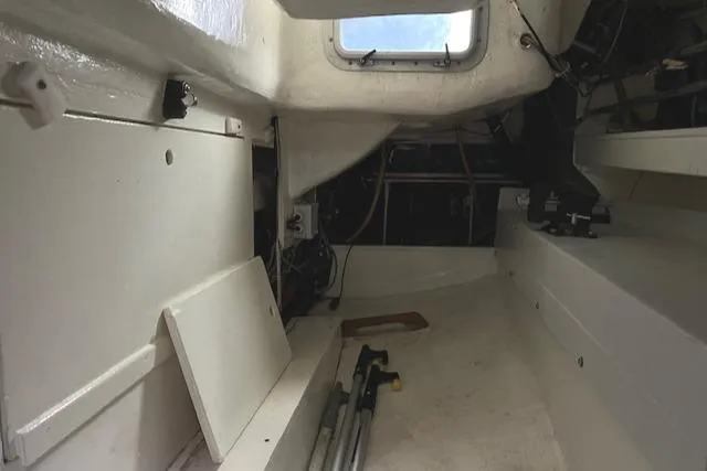Slide: The Image of Interior of 1994 J Boats J 44 sailboat, featuring storage and seating area. - 14