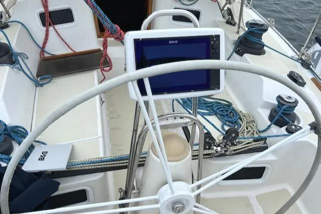 Slide: The Image of Cockpit of 1994 J Boats J 44 sailboat with steering wheel and navigation equipment. - 4