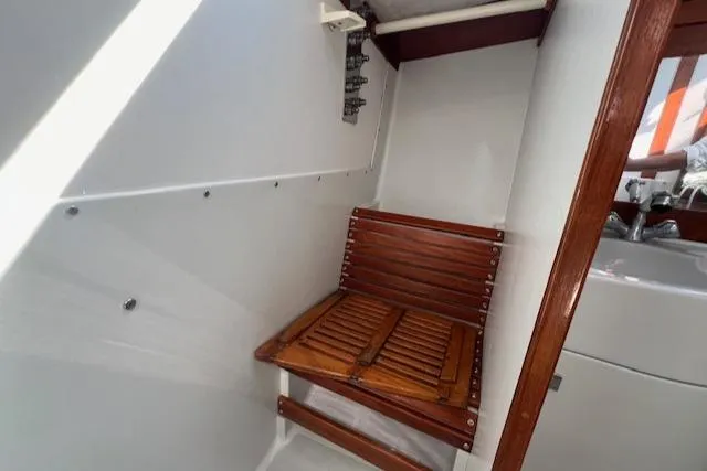 Slide: The Image of Wooden seat in 1994 J Boats J 44 sailboat interior. - 8