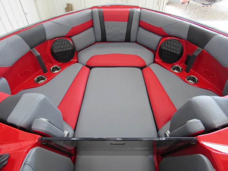 Slide: The Image of 2024 Malibu Wakesetter 23 LSV interior, red and gray seating with cup holders. - 10