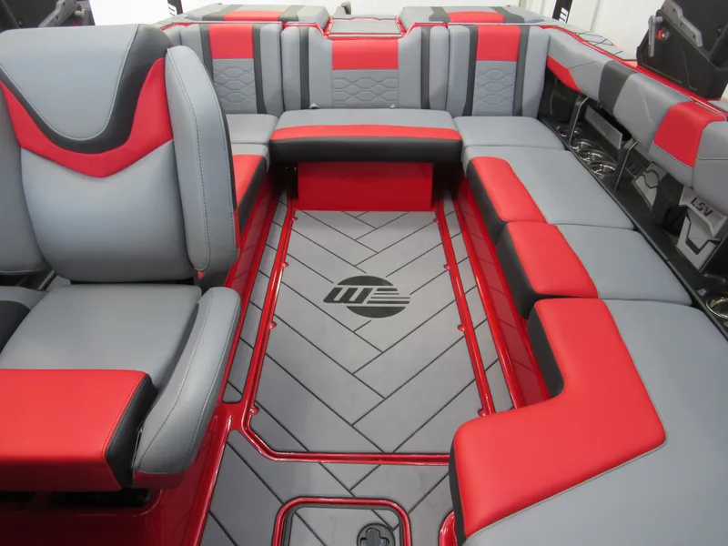 Slide: The Image of 2024 Malibu Wakesetter 23 LSV interior with red and gray seating. - 11
