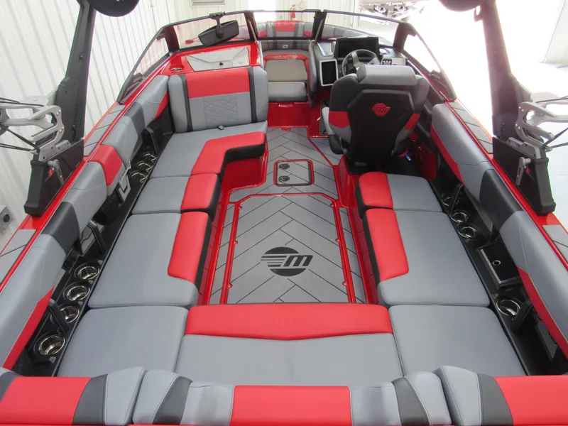 Slide: The Image of 2024 Malibu Wakesetter 23 LSV interior with red and gray seating, modern design. - 3