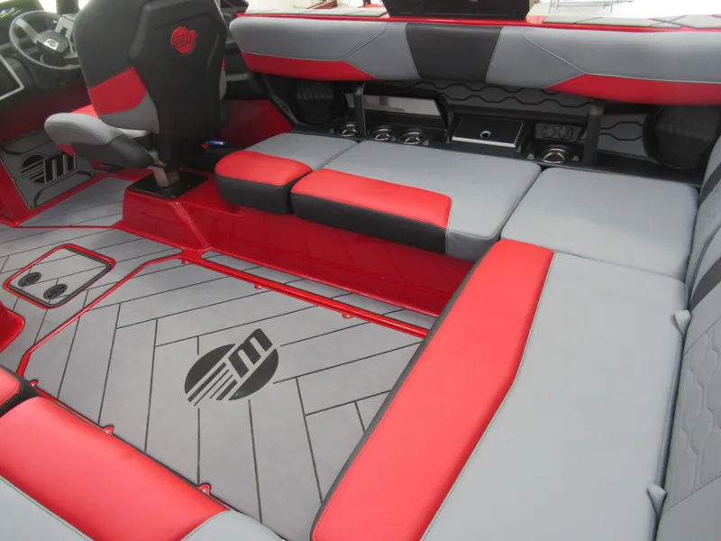 Slide: The Image of 2024 Malibu Wakesetter 23 LSV interior with red and gray seating. - 4