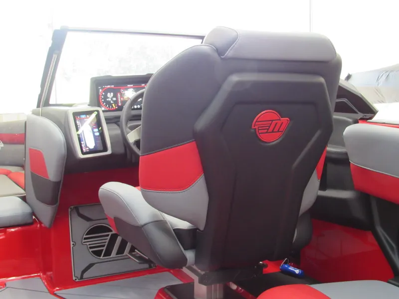 Slide: The Image of 2024 Malibu Wakesetter 23 LSV interior with red and black seating and dashboard controls. - 6