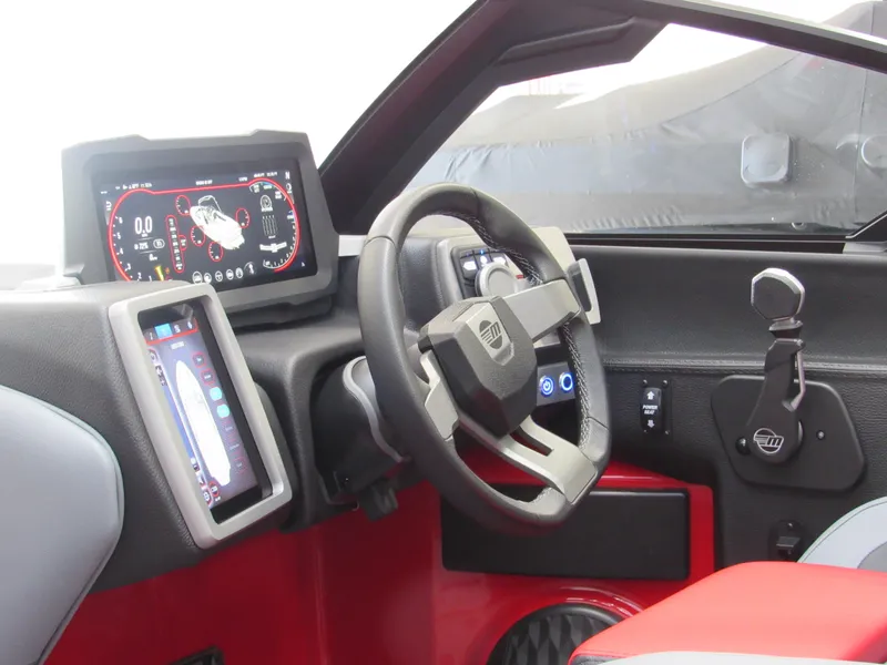 Slide: The Image of 2024 Malibu Wakesetter 23 LSV dashboard with modern controls and digital displays. - 7