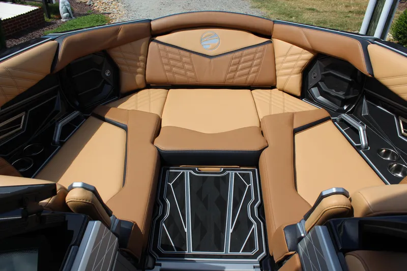 Slide: The Image of 2024 Tigé Ultré 23ZX boat interior with luxurious tan seating and modern design. - 12