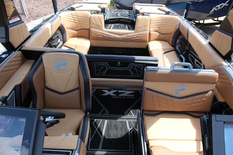 Slide: The Image of 2024 Tigé Ultré 23ZX boat interior with luxurious tan seating and modern design. - 13