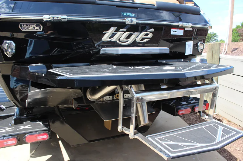 Slide: The Image of 2024 Tigé Ultré 23ZX boat rear view with swim platform and TAPS 3T system. - 4