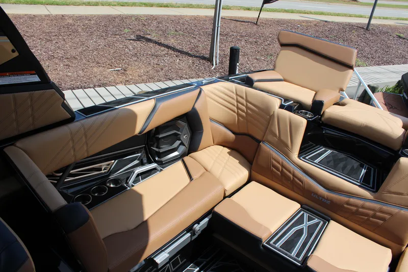 Slide: The Image of 2024 Tigé Ultré 23ZX boat interior with luxurious tan seating and modern design. - 8