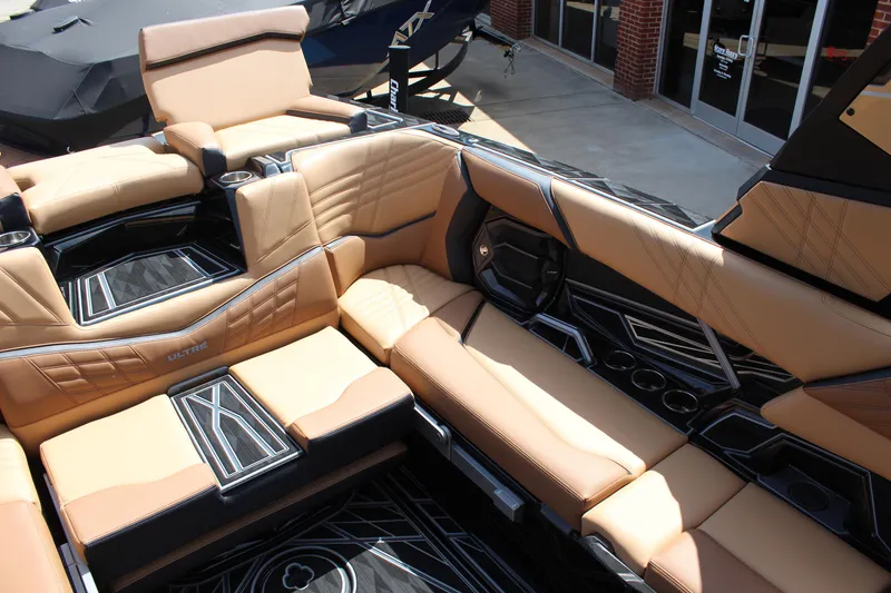 Slide: The Image of 2024 Tigé Ultré 23ZX boat interior with luxurious tan seating and modern design. - 9