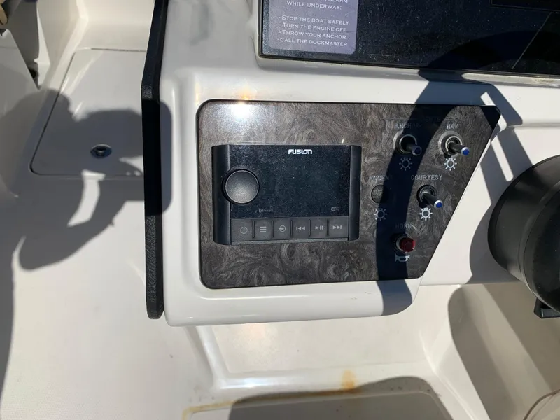 Slide: The Image of Control panel of 2022 Sea Ray SPX 230 OB boat with Fusion audio system. - 6