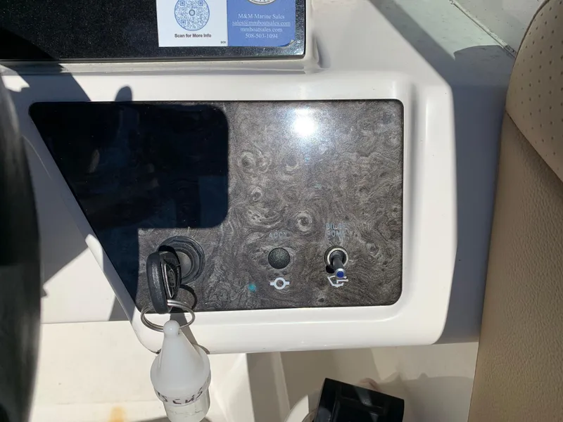 Slide: The Image of Control panel of 2022 Sea Ray SPX 230 OB boat with ignition key. - 7