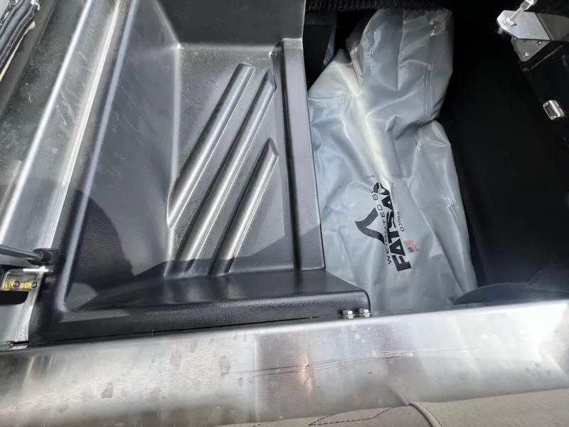 Slide: The Image of 2024 Centurion Ri230 storage compartment with protective cover. - 10