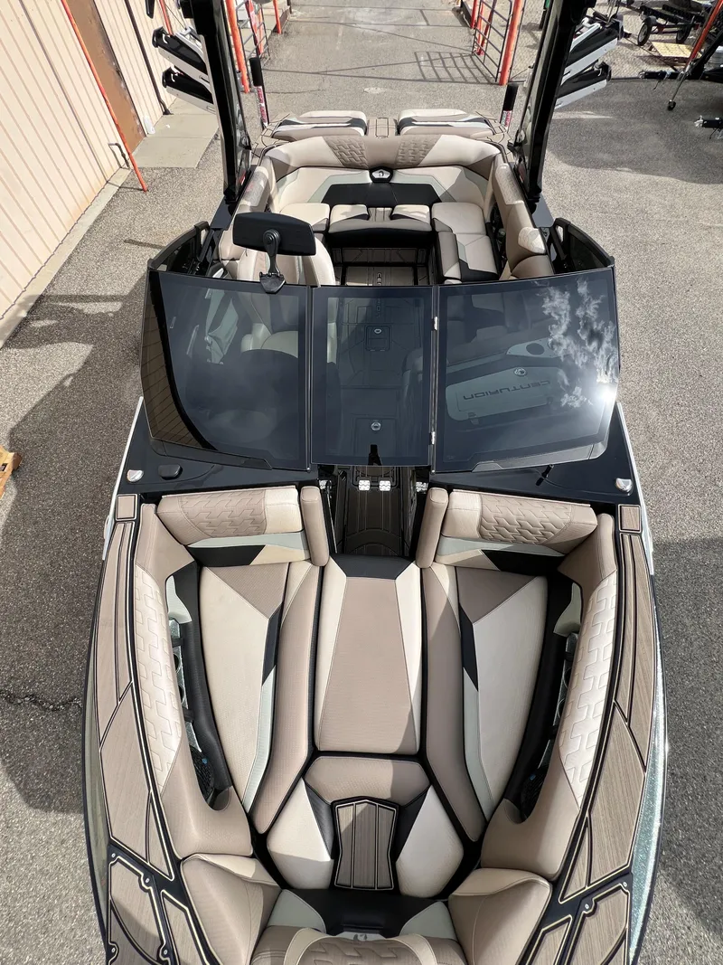 Slide: The Image of 2024 Centurion Ri230 boat interior with luxurious seating and sleek design. - 11