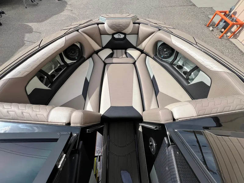 Slide: The Image of 2024 Centurion Ri230 boat interior with luxurious seating and modern design. - 12