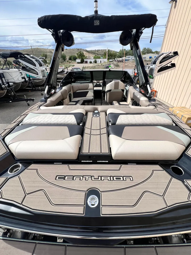 Slide: The Image of 2024 Centurion Ri230 boat with spacious seating and sleek design. - 16