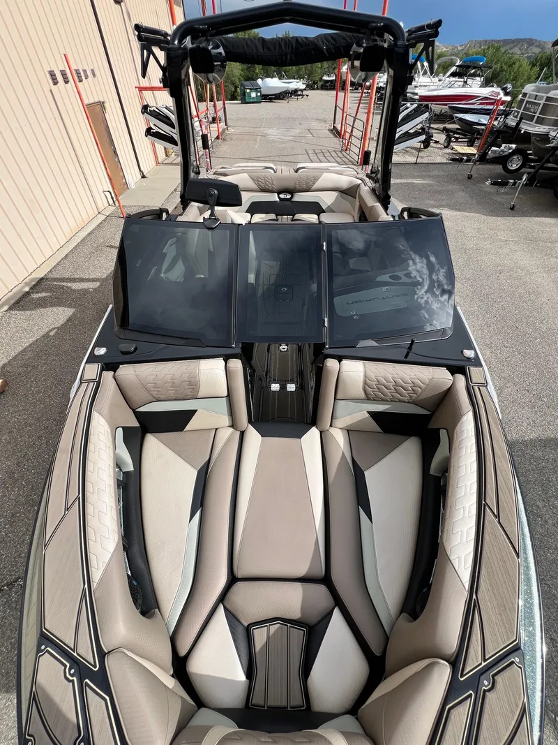 Slide: The Image of 2024 Centurion Ri230 boat with sleek interior design and modern features. - 17