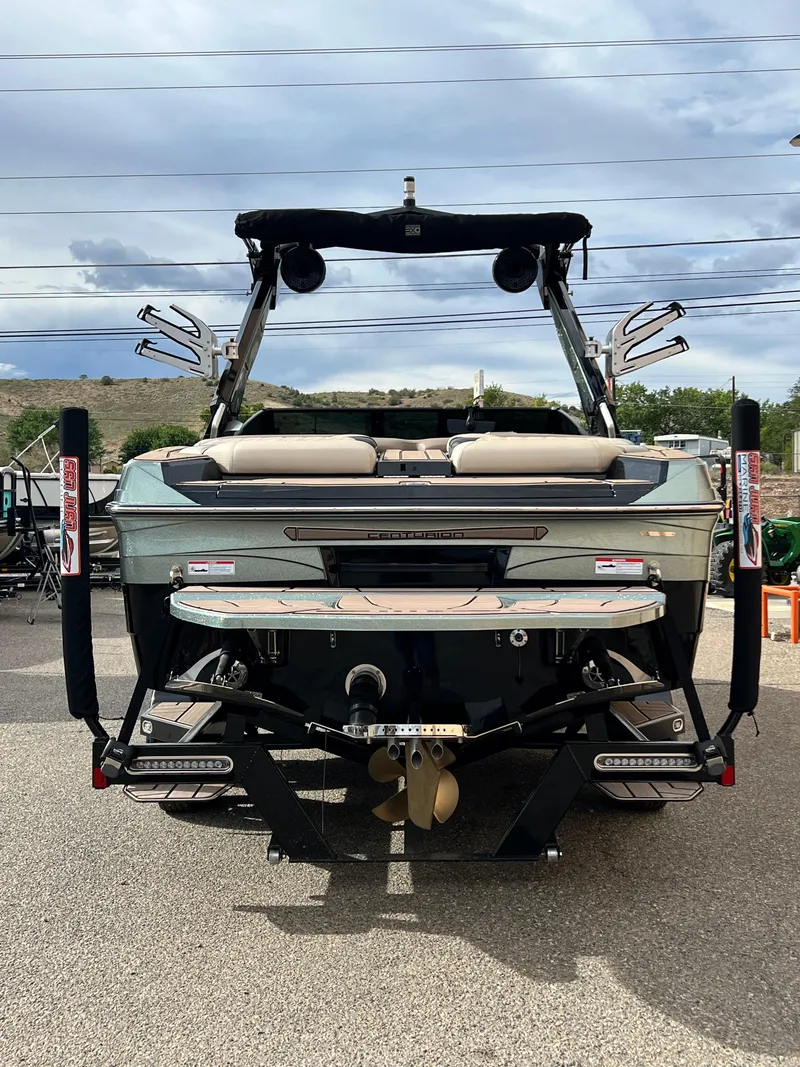 Slide: The Image of 2024 Centurion Ri230 boat, rear view, showcasing sleek design and advanced features. - 4