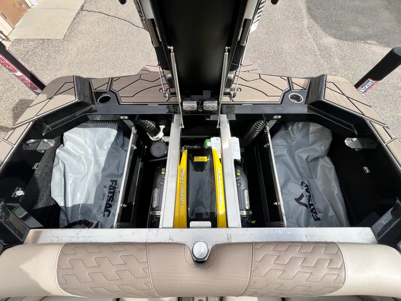 Slide: The Image of 2024 Centurion Ri230 boat interior storage compartments with ballast bags. - 9