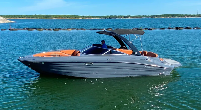 The Image of 2017 Cruisers Sport Series 298 SS South Beach Edition boat on calm water. - 0