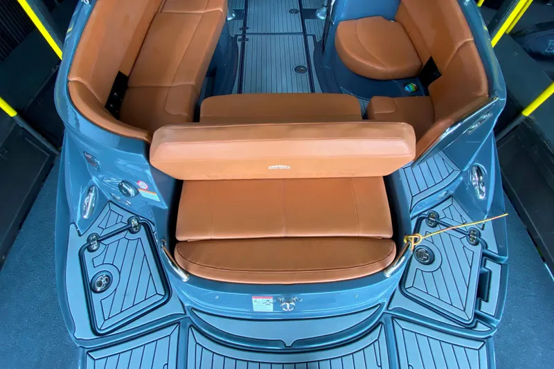 Slide: The Image of 2017 Cruisers Sport Series 298 SS South Beach Edition boat interior with tan seating. - 13
