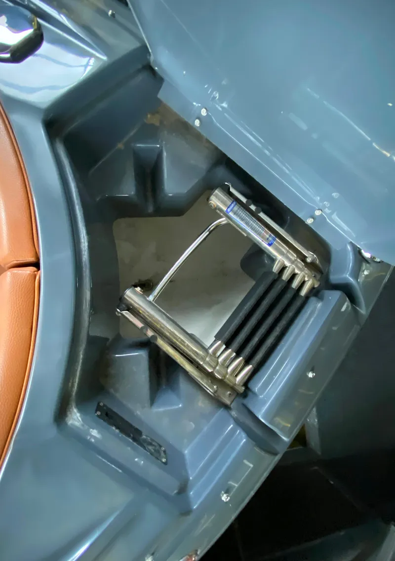 Slide: The Image of 2017 Cruisers Sport Series 298 SS South Beach Edition boat ladder and storage compartment. - 24