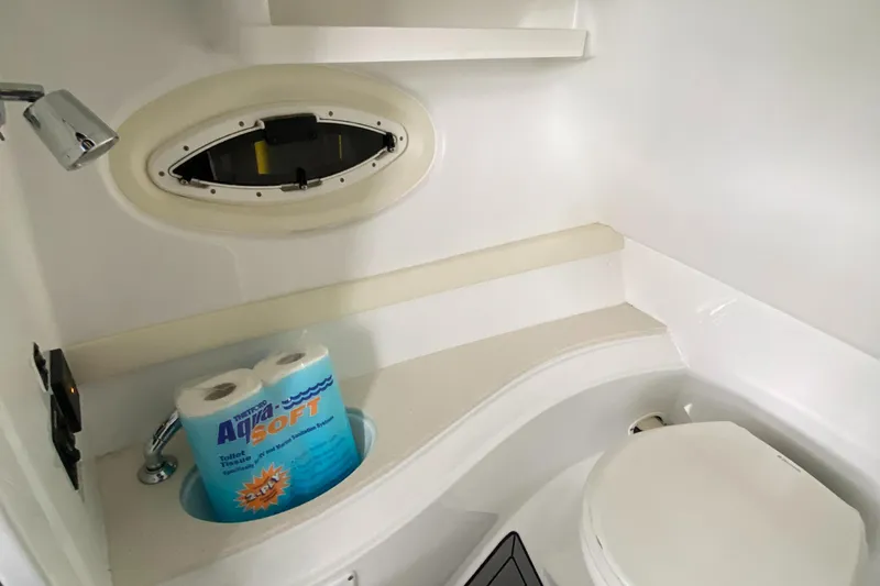 Slide: The Image of 2017 Cruisers Sport Series 298 SS South Beach Edition bathroom interior with toilet and window. - 29