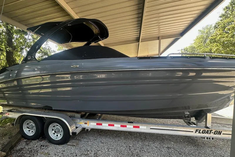 Slide: The Image of 2017 Cruisers Sport Series 298 SS South Beach Edition boat on trailer under shelter. - 7