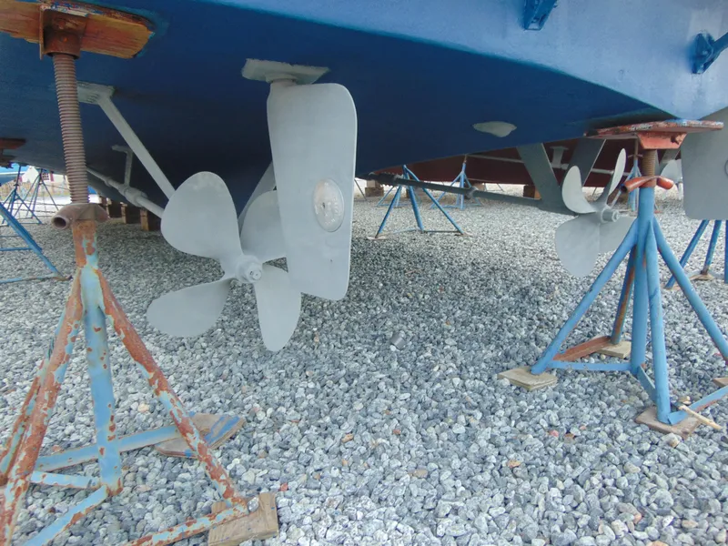 Slide: The Image of 1972 Hatteras Yachtfish on dry dock between two other boats. - 10