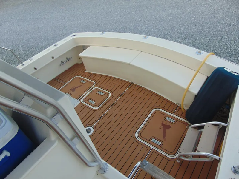 Slide: The Image of 1972 Hatteras Yachtfish on dry dock, surrounded by other boats. - 11