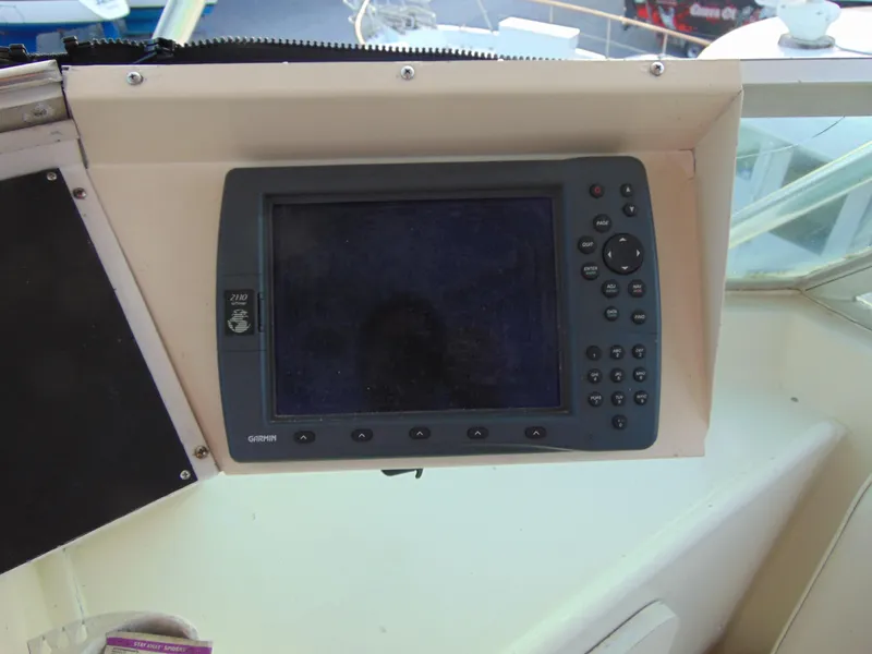 Slide: The Image of 1972 Hatteras Yachtfish bathroom with fish-themed wallpaper and white sink. - 26