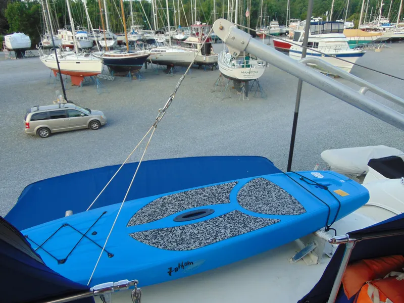 Slide: The Image of 1972 Hatteras Yachtfish helm with white seating and steering wheel. - 27